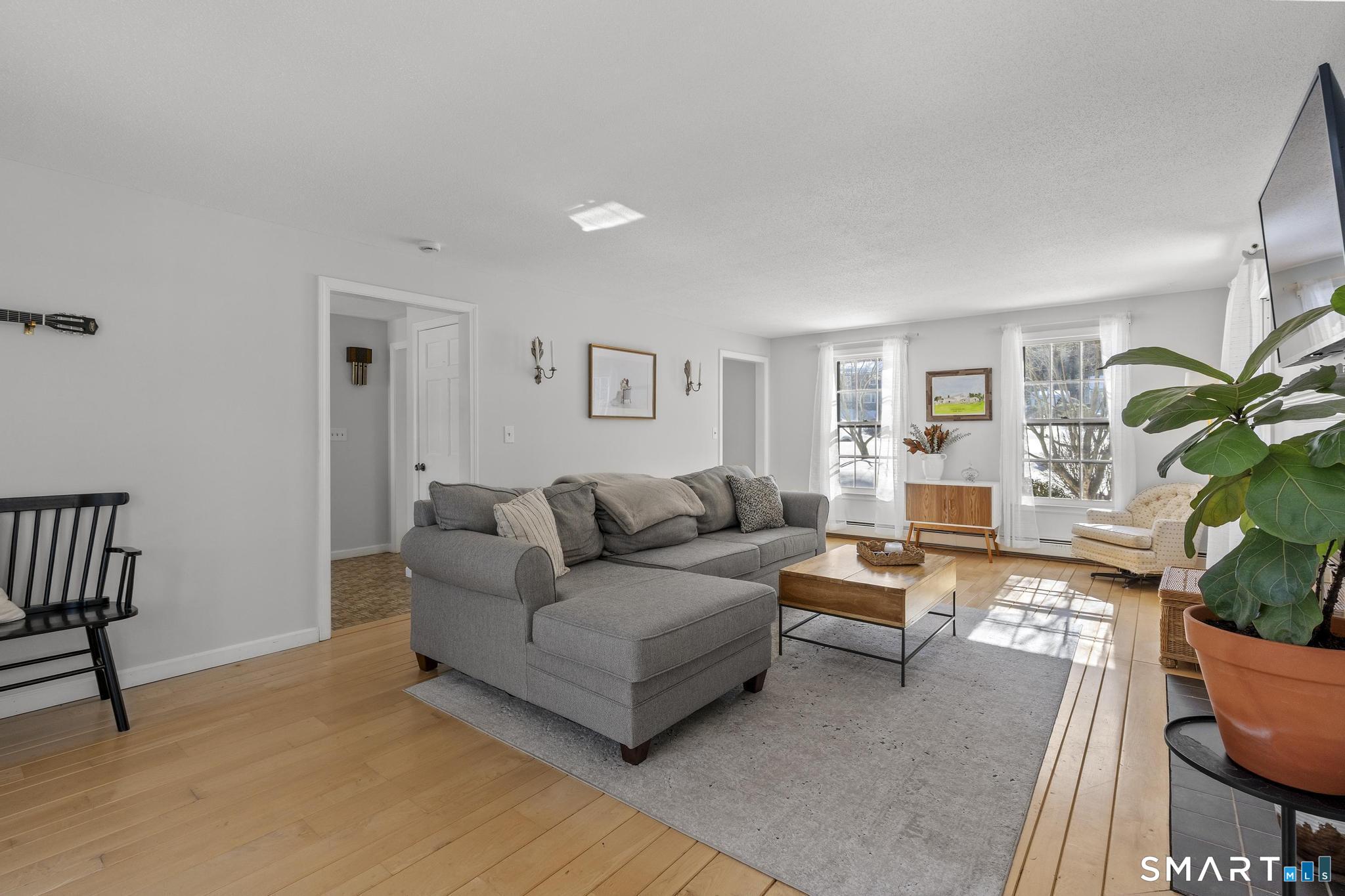 102 Cold Spring Road Avon, CT 06001 - Photo 3 of 40 a living room with furniture and a potted plant