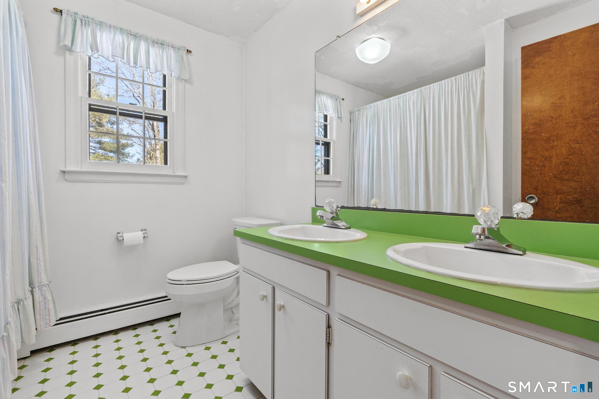 102 Cold Spring Road Avon, CT 06001 - Photo 34 of 40 a bathroom with a granite countertop toilet and a sink