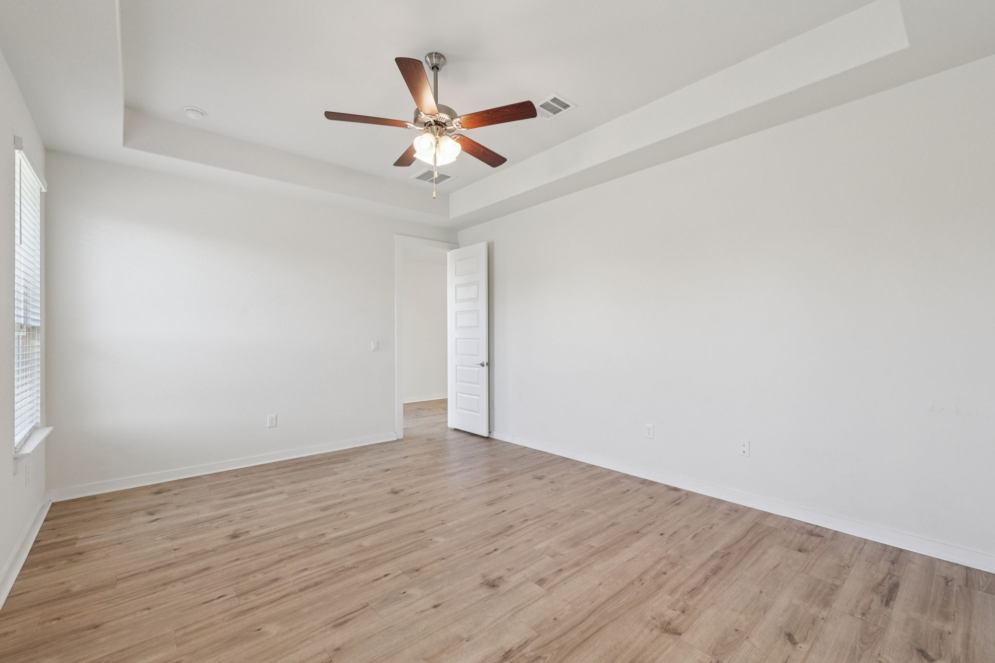 1024 Bear Track Loop Georgetown, TX 78628 - Photo 13 of 35 a view of a big room with wooden floor closet and fan