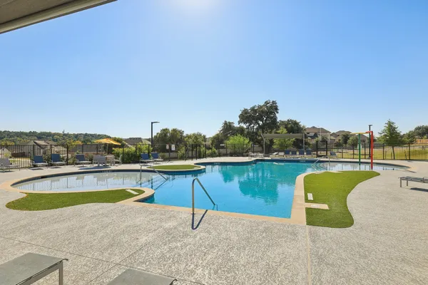 a view of a swimming pool and an outdoor seating