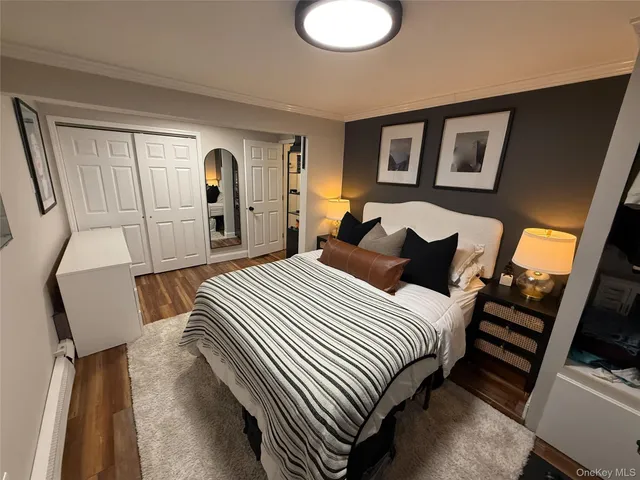 a bedroom with bed and a chair