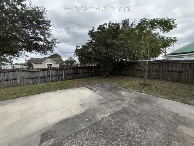 a view of backyard with green space