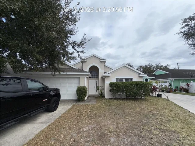a view of a car parked in front of a house