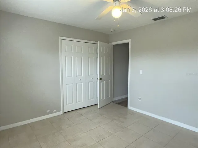 an empty room with a bathroom