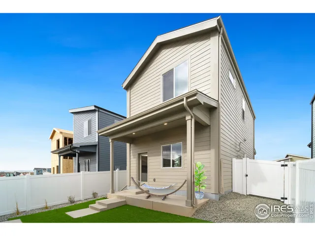 a view of house with backyard