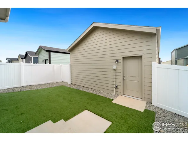 a view of a backyard of the house