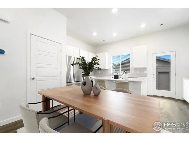 a kitchen with a table and chairs