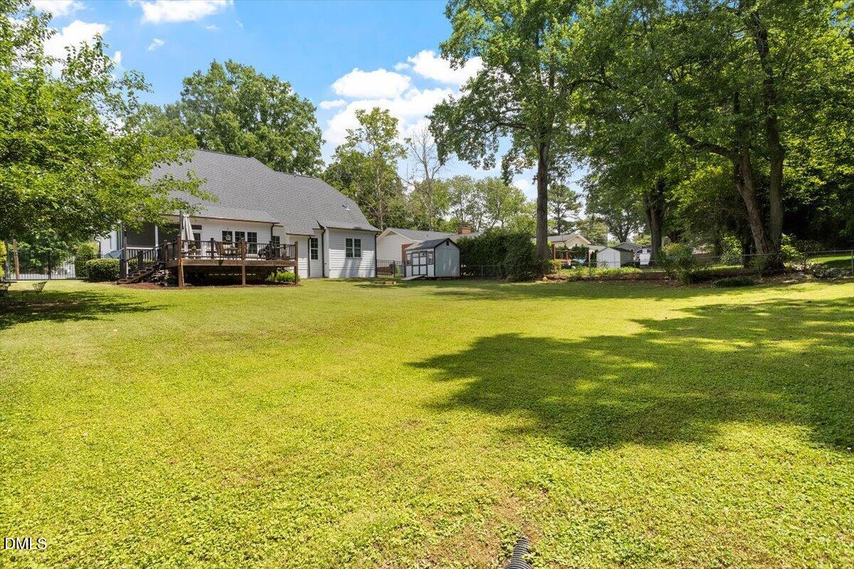 1404 Ivy Lane Raleigh, NC 27609 - Photo 33 of 37 Expansive lawn with mature trees