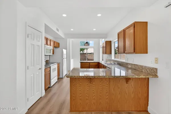 a view of a kitchen with a sink and a window
