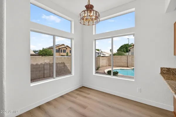 a kitchen with stainless steel appliances granite countertop a sink dishwasher stove and oven with wooden floor