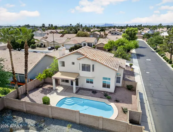 a view of a house with a chairs in patio