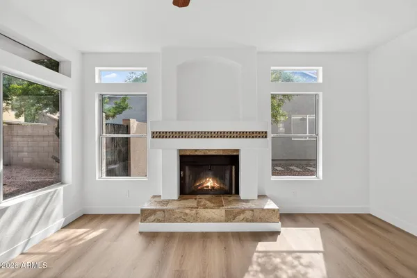 a living room with a fireplace furniture and a window