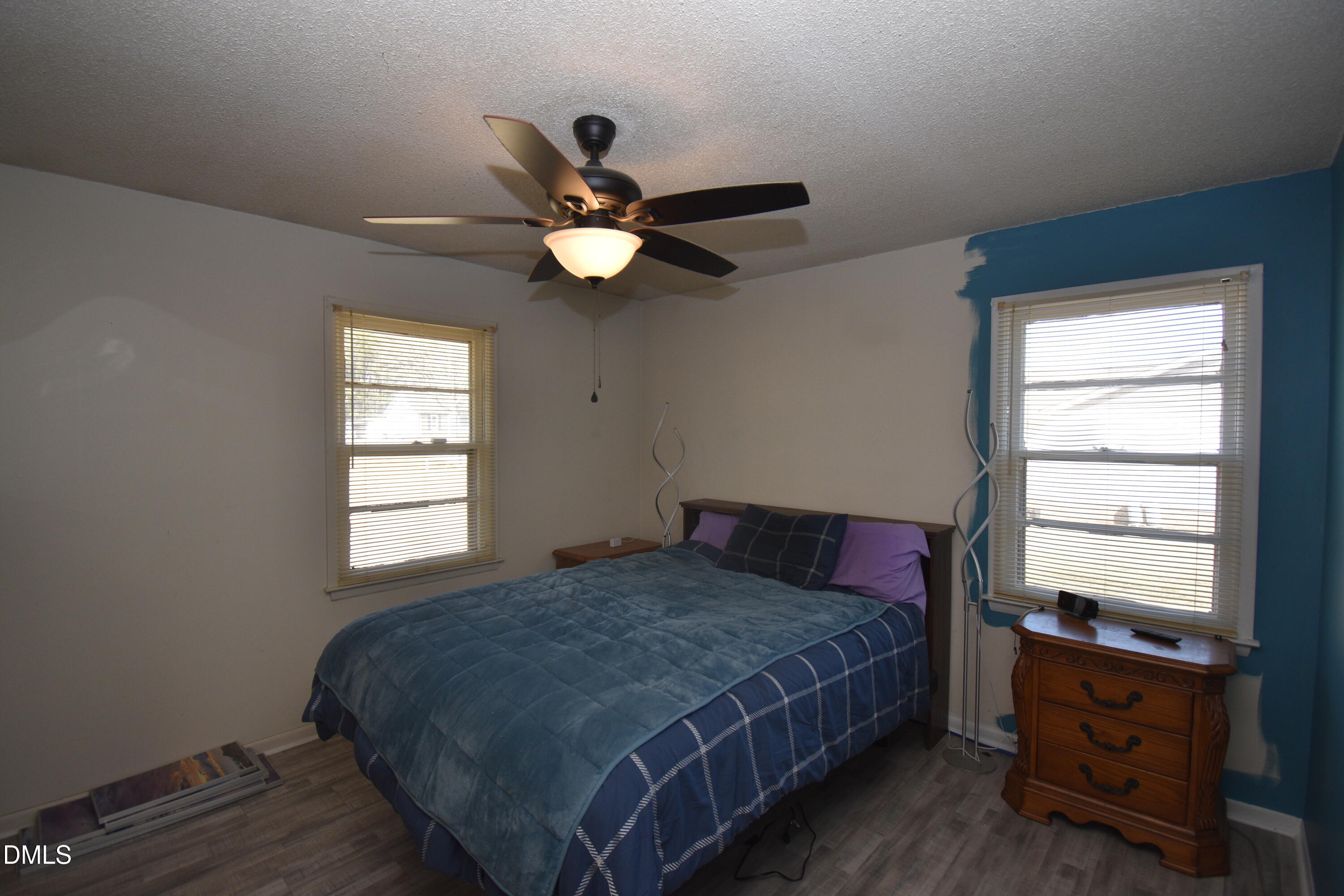 216 Sullivan Road Selma, NC 27576 - Photo 11 of 24 a bedroom with a bed and a window