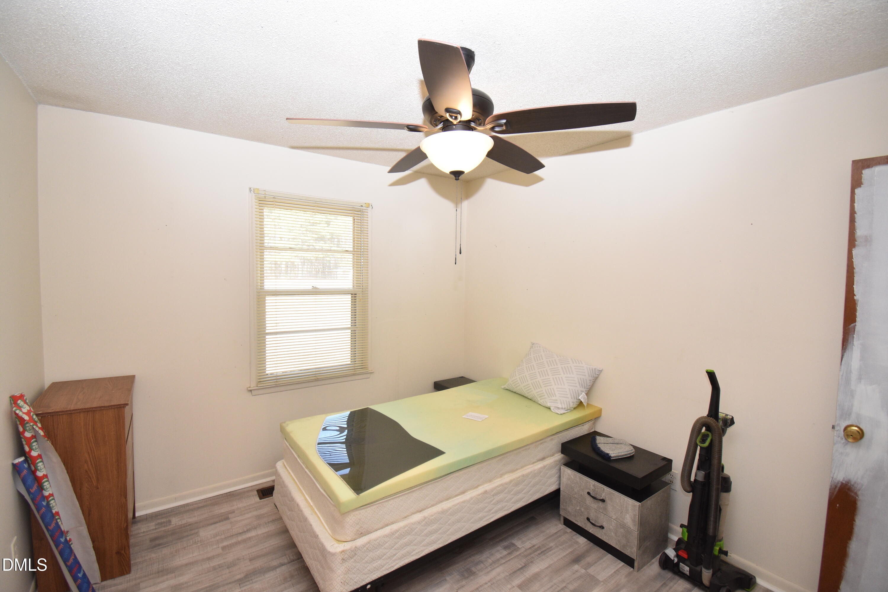216 Sullivan Road Selma, NC 27576 - Photo 14 of 24 a living room with furniture and a window