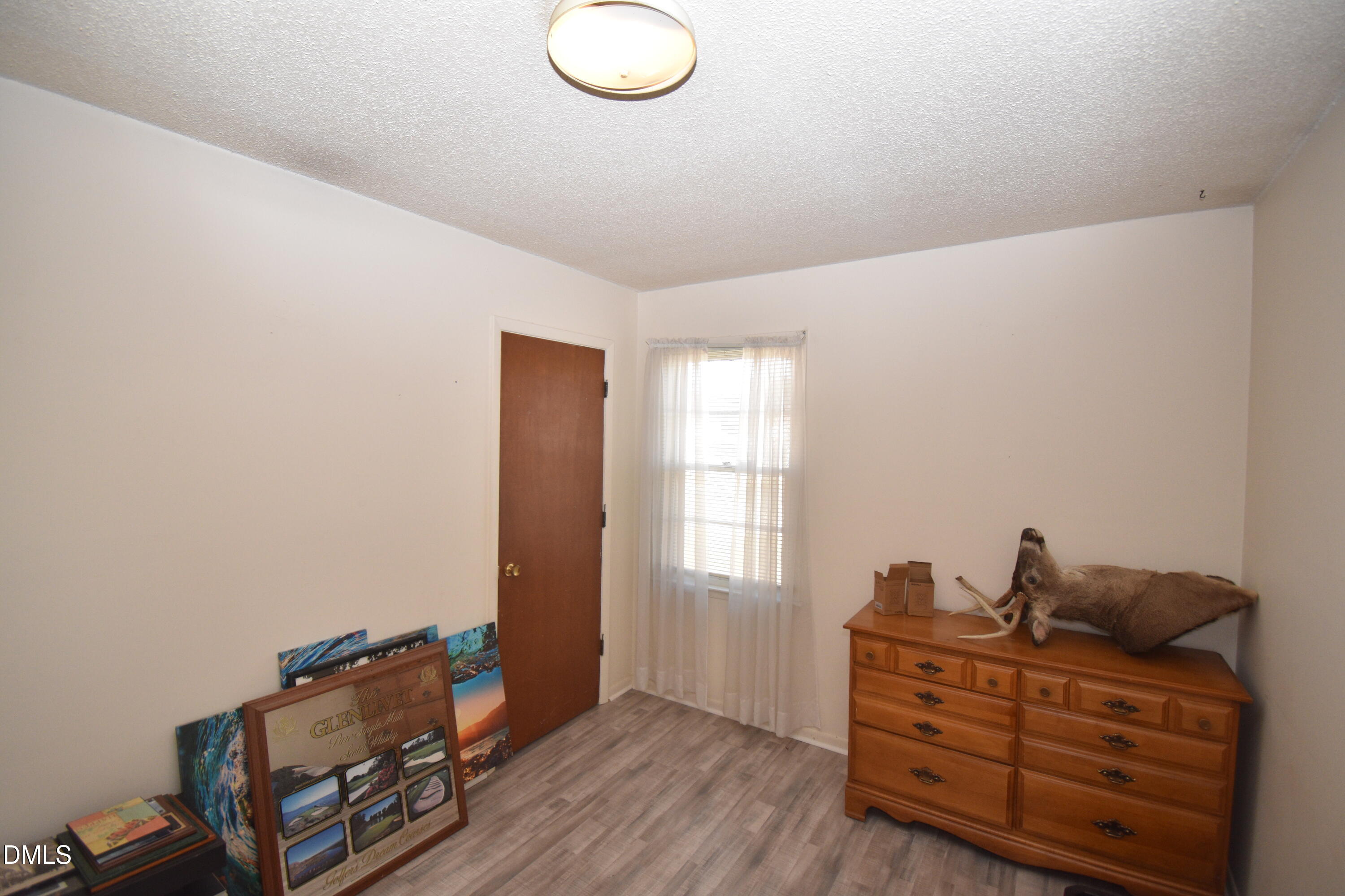 216 Sullivan Road Selma, NC 27576 - Photo 18 of 24 a room with furniture and window