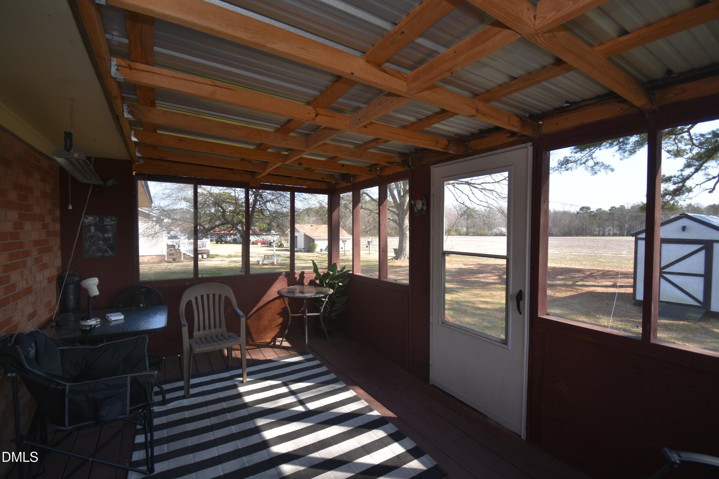 216 Sullivan Road Selma, NC 27576 - Photo 19 of 24 a living room with furniture next to a large window