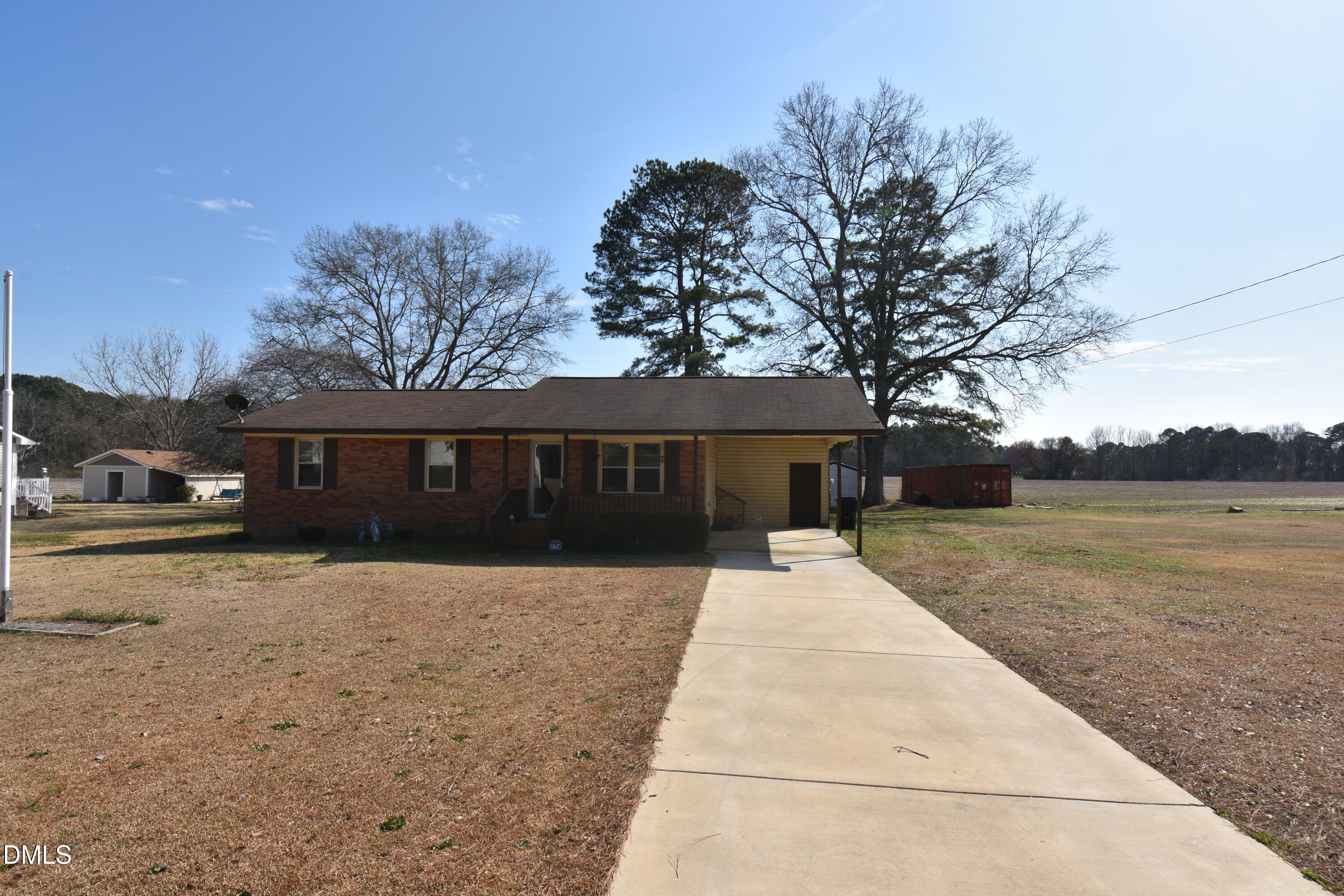 216 Sullivan Road Selma, NC 27576 - Photo 2 of 24 a front view of a house with a yard and trees