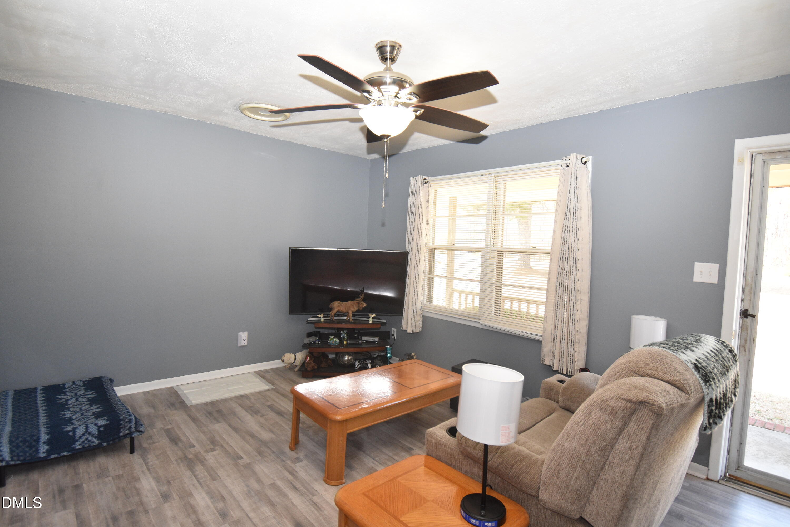 216 Sullivan Road Selma, NC 27576 - Photo 4 of 24 a work room with furniture and a window