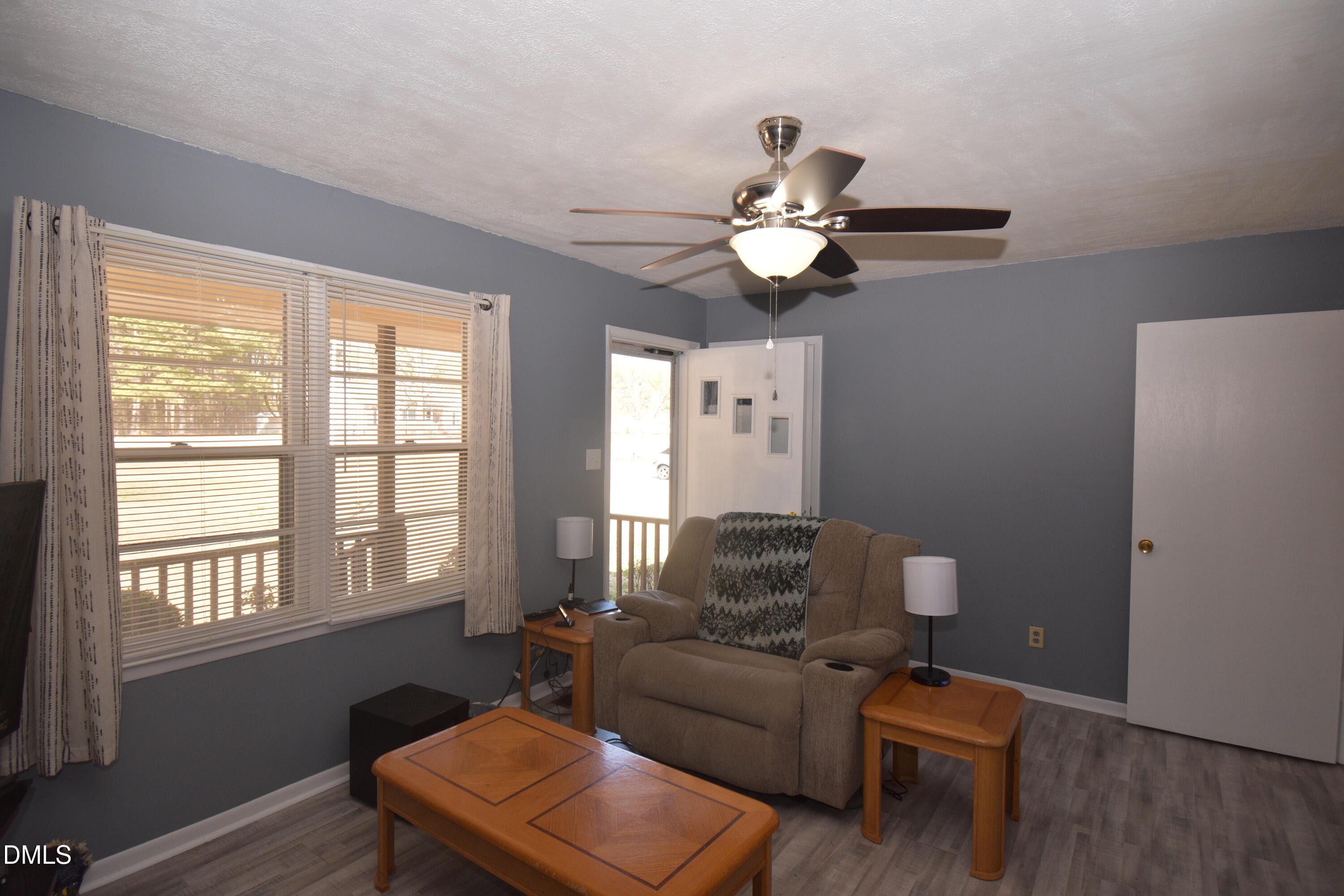 216 Sullivan Road Selma, NC 27576 - Photo 7 of 24 a living room with furniture a couch and a window