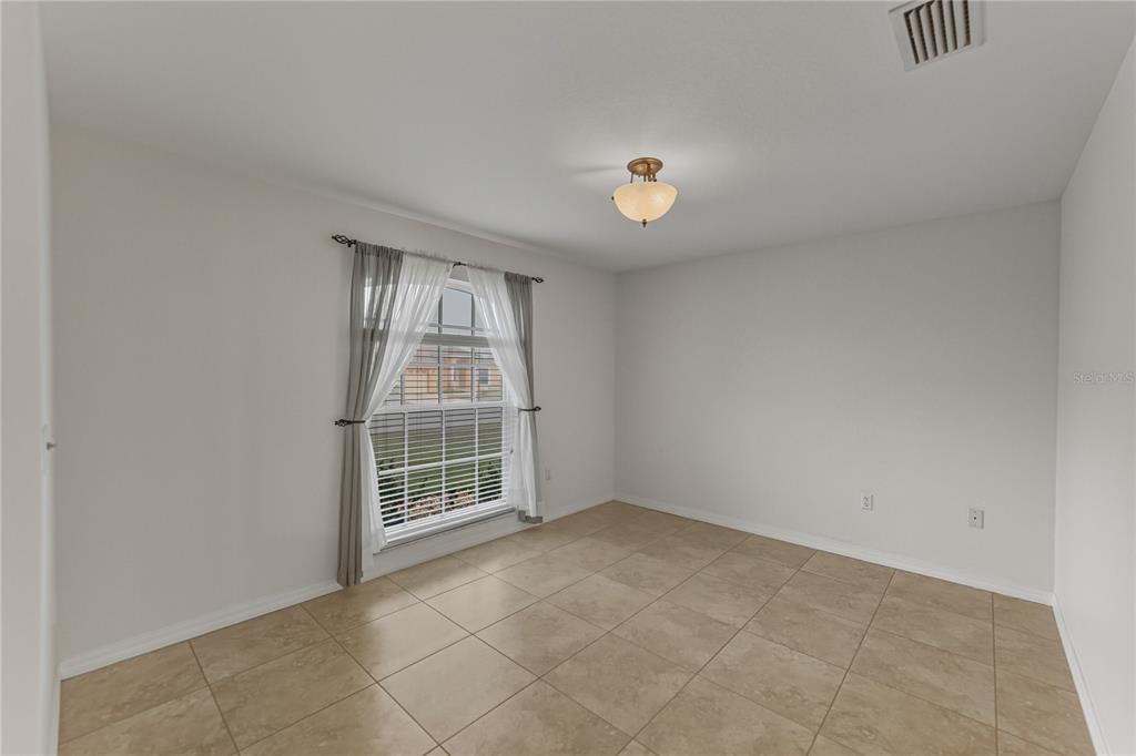 315 Cloverdale Road Winter Haven, FL 33884 - Photo 12 of 65 an empty room with windows