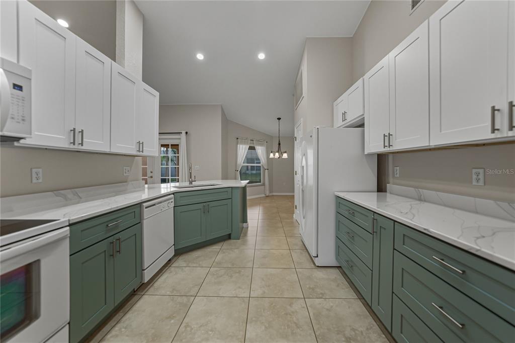 315 Cloverdale Road Winter Haven, FL 33884 - Photo 29 of 65 a kitchen with a sink and cabinets