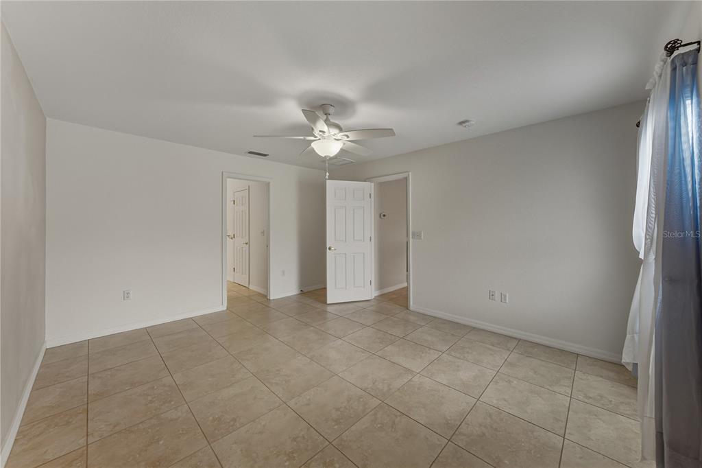 315 Cloverdale Road Winter Haven, FL 33884 - Photo 34 of 65 a view of an empty room with a ceiling fan