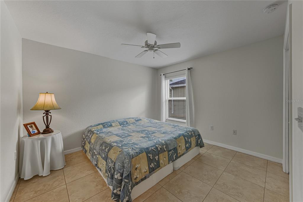 315 Cloverdale Road Winter Haven, FL 33884 - Photo 43 of 65 a bedroom with a bed and ceiling fan