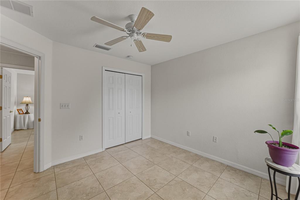 315 Cloverdale Road Winter Haven, FL 33884 - Photo 51 of 65 a view of a livingroom with a chandelier fan and wooden floor