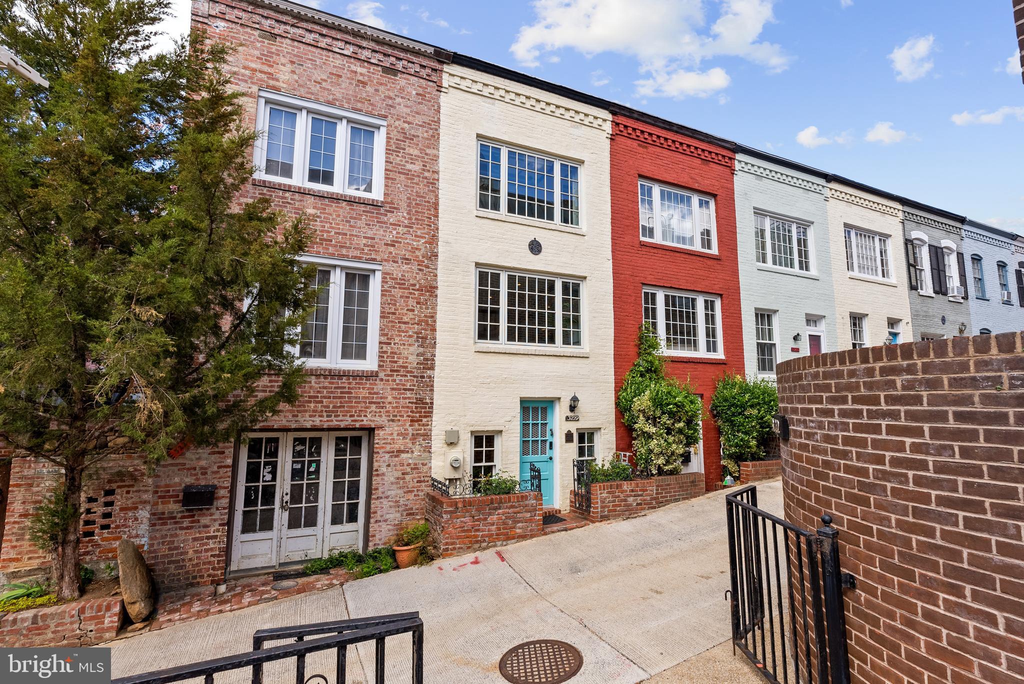 3219 Cherry Hill Lane Washington, DC 20007 - Photo 1 of 32 a front view of a house with a garden