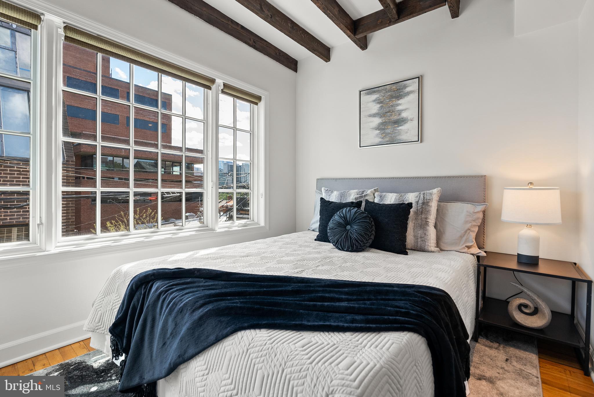 3219 Cherry Hill Lane Washington, DC 20007 - Photo 20 of 32 a bedroom with a bed and a window