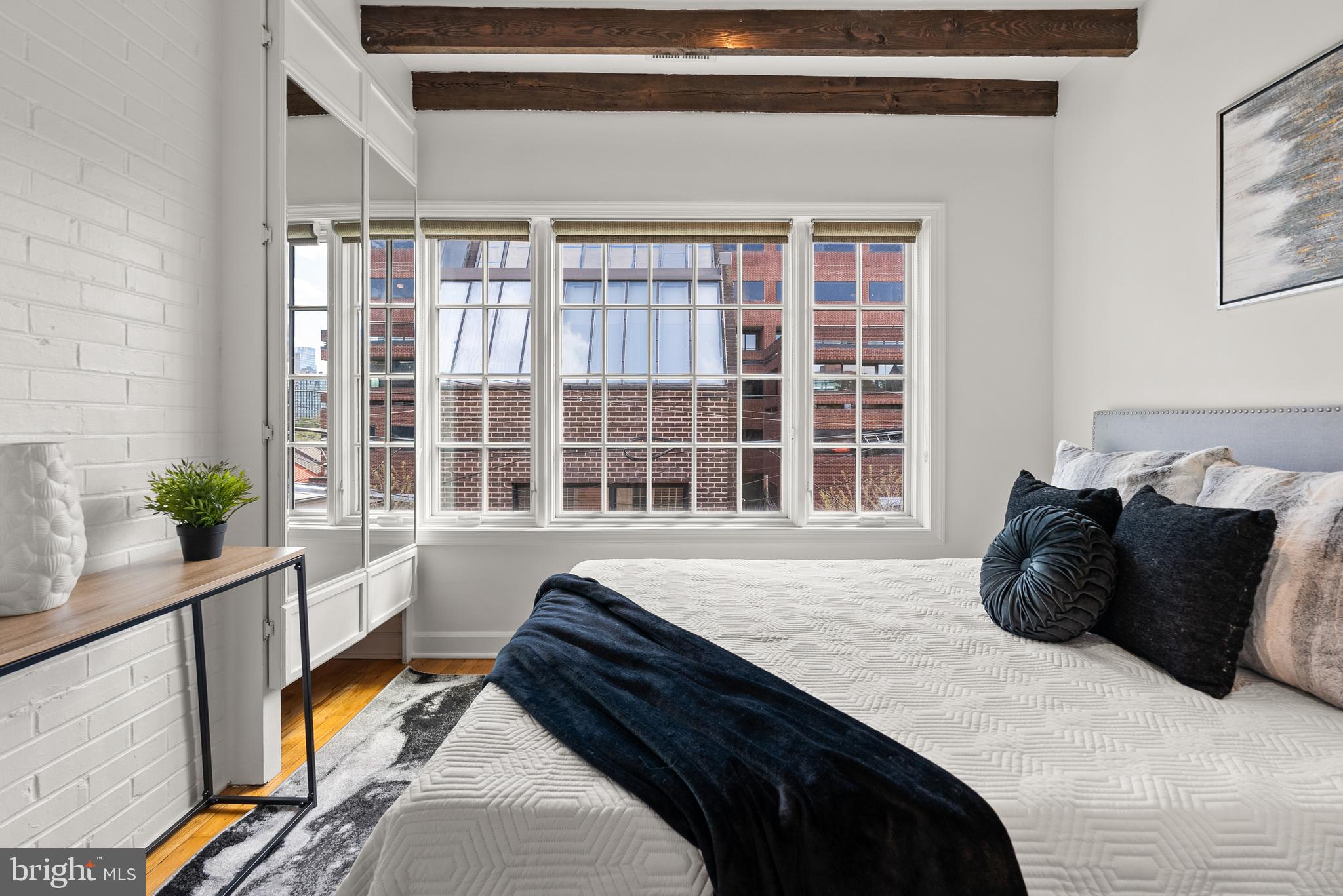 3219 Cherry Hill Lane Washington, DC 20007 - Photo 21 of 32 a bedroom with a bed and a large window
