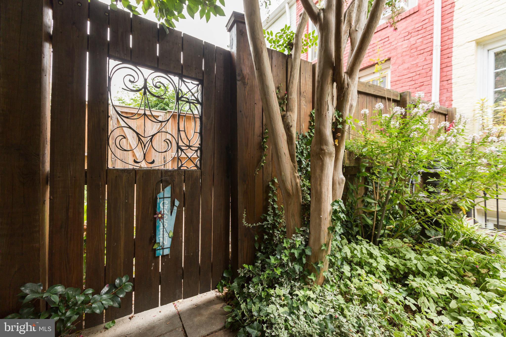 3219 Cherry Hill Lane Washington, DC 20007 - Photo 28 of 32 a view of sign board with potted plants