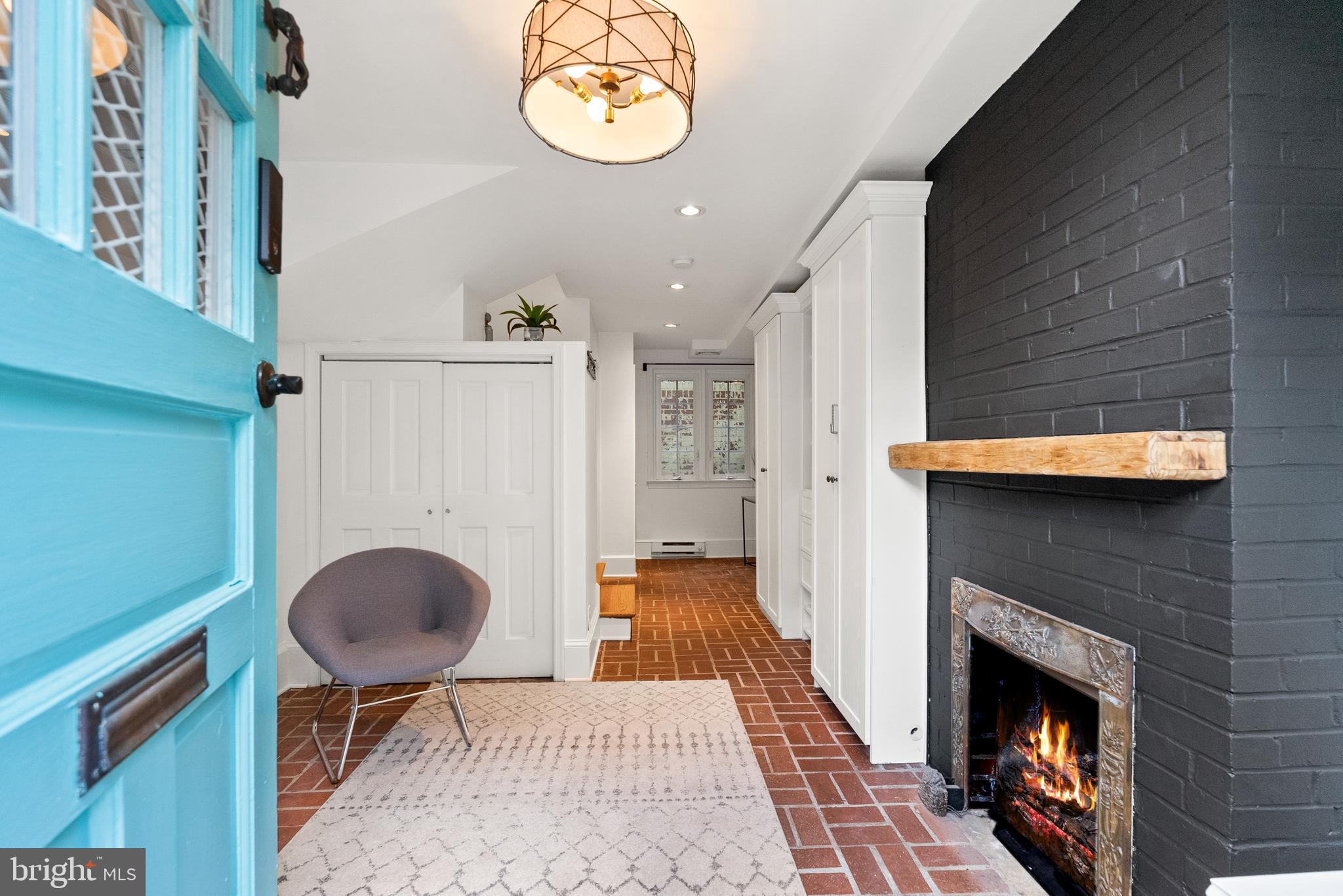 3219 Cherry Hill Lane Washington, DC 20007 - Photo 4 of 32 an entryway with a rug and a fireplace