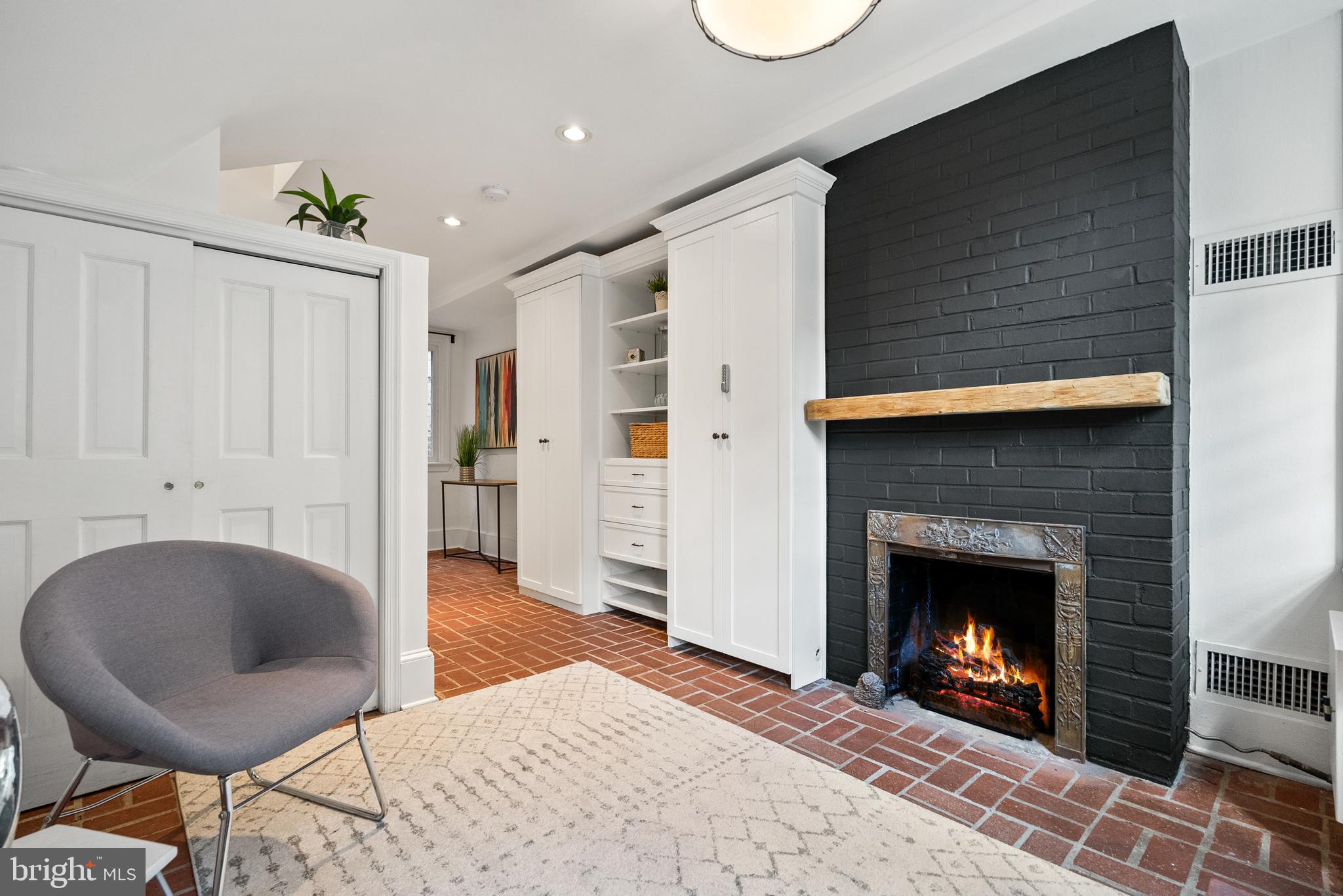 3219 Cherry Hill Lane Washington, DC 20007 - Photo 6 of 32 a living room with furniture and a fireplace