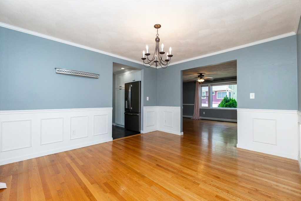 63 Bow Street Saugus, MA 01906 - Photo 8 of 42 a view of a kitchen with cabinet and wooden floor