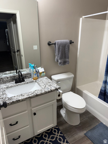 14797 South Chandlerpoint Way Draper, UT 84020 - Photo 24 of 33 Bathroom featuring a white vanity with a speckled countertop, undermount sink, and matte black faucet