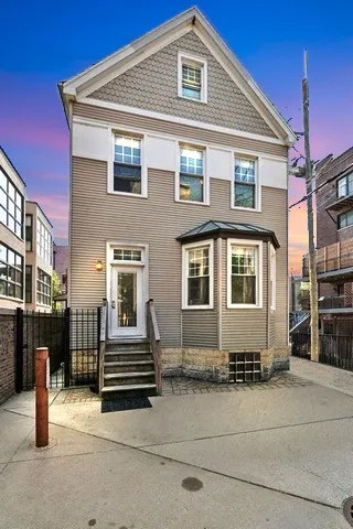 a front view of a house with stairs