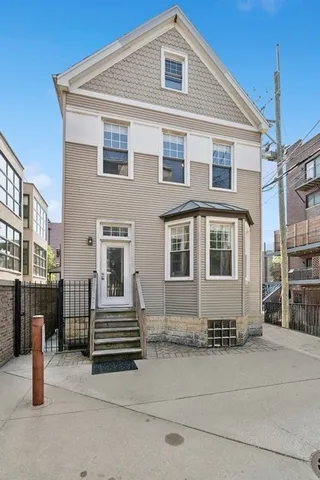 a front view of a house with stairs