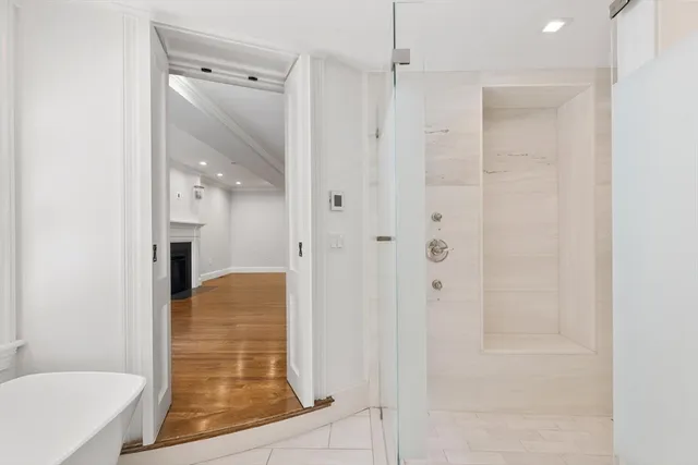 a bathroom with a shower and a tub