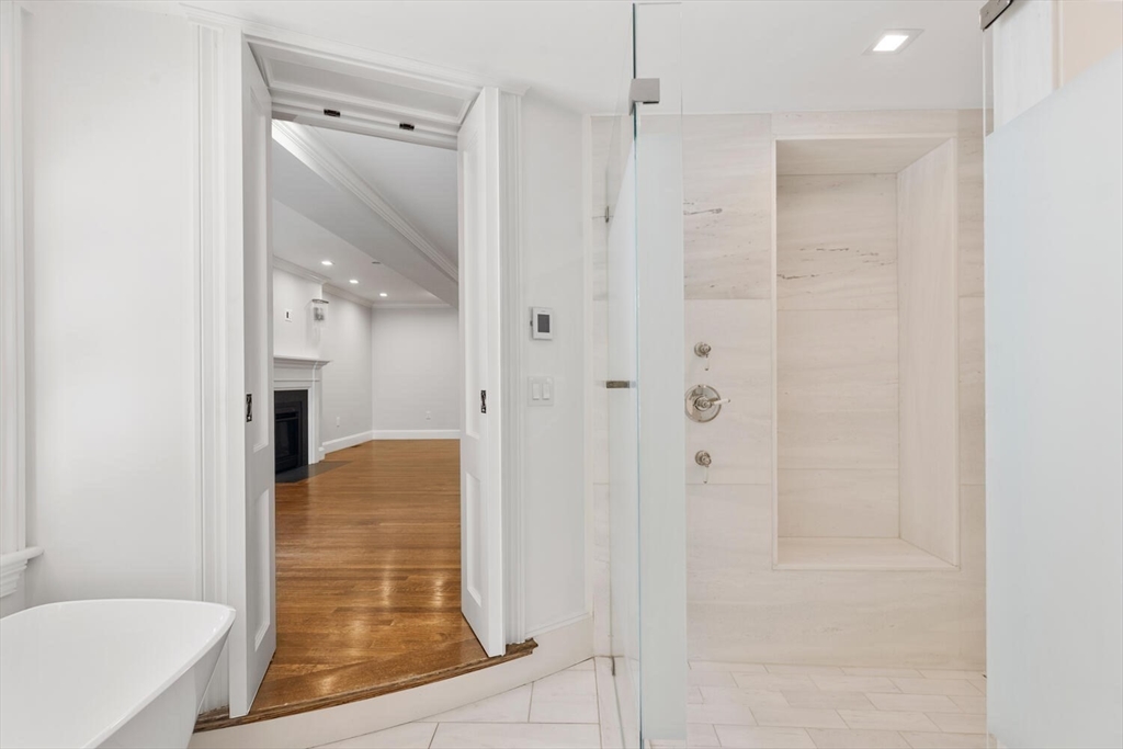 20 Chestnut Street, Unit 1 Boston, MA 02108 - Photo 16 of 25 a bathroom with a shower and a tub