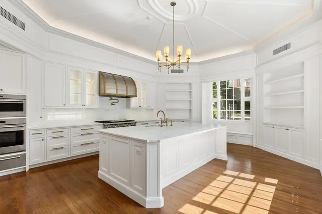 a kitchen with a stove a sink and a refrigerator