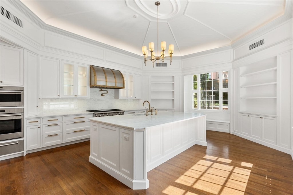 20 Chestnut Street, Unit 1 Boston, MA 02108 - Photo 4 of 25 a kitchen with a stove a sink and a refrigerator