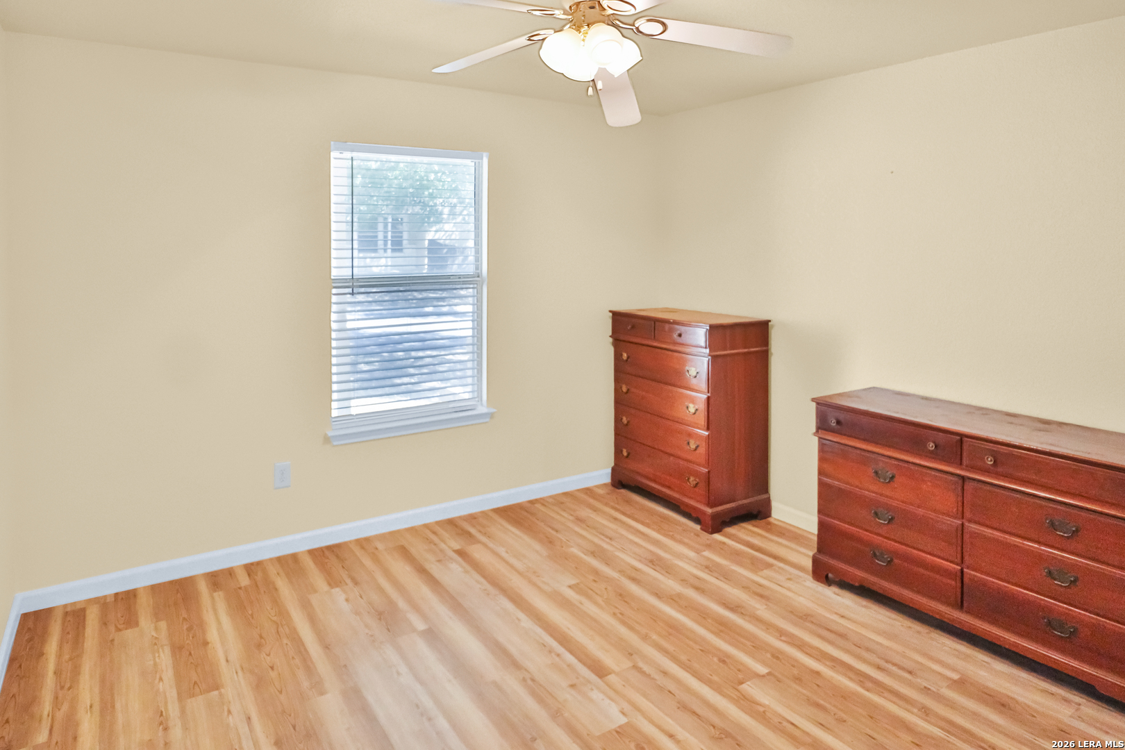 3202 Eisenhauer Road, Unit 402 San Antonio, TX 78209 - Photo 8 of 10 a view of room with window and wooden floor
