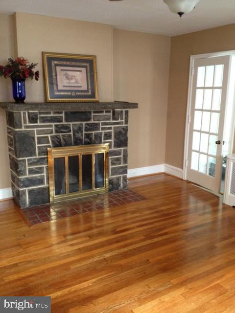 2428 East County Line Road Ardmore, PA 19003 - Photo 7 of 26 living room/stone fireplace