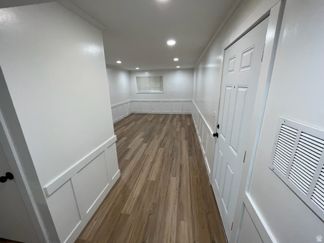 6884 670 East Midvale, UT 84047 - Photo 8 of 28 Hall with a decorative wall, a wainscoted wall, dark wood-style flooring, recessed lighting, and crown molding