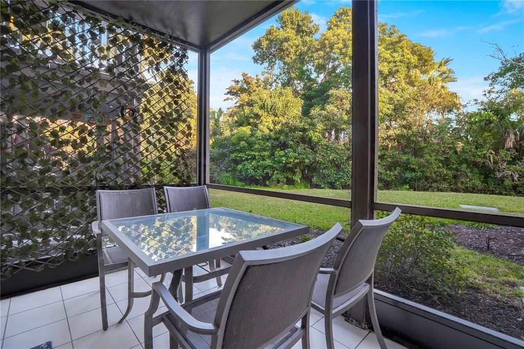 1646 Stickney Point Road, Unit 1646101 Sarasota, FL 34231 - Photo 17 of 67 a view of an outdoor sitting area with furniture
