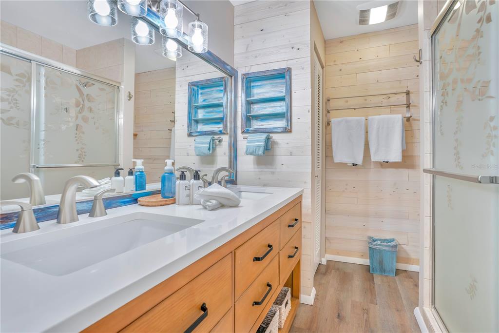 1646 Stickney Point Road, Unit 1646101 Sarasota, FL 34231 - Photo 24 of 67 a bathroom with a sink a toilet and shower