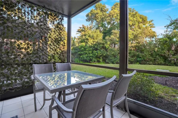 a view of a swimming pool with outdoor seating