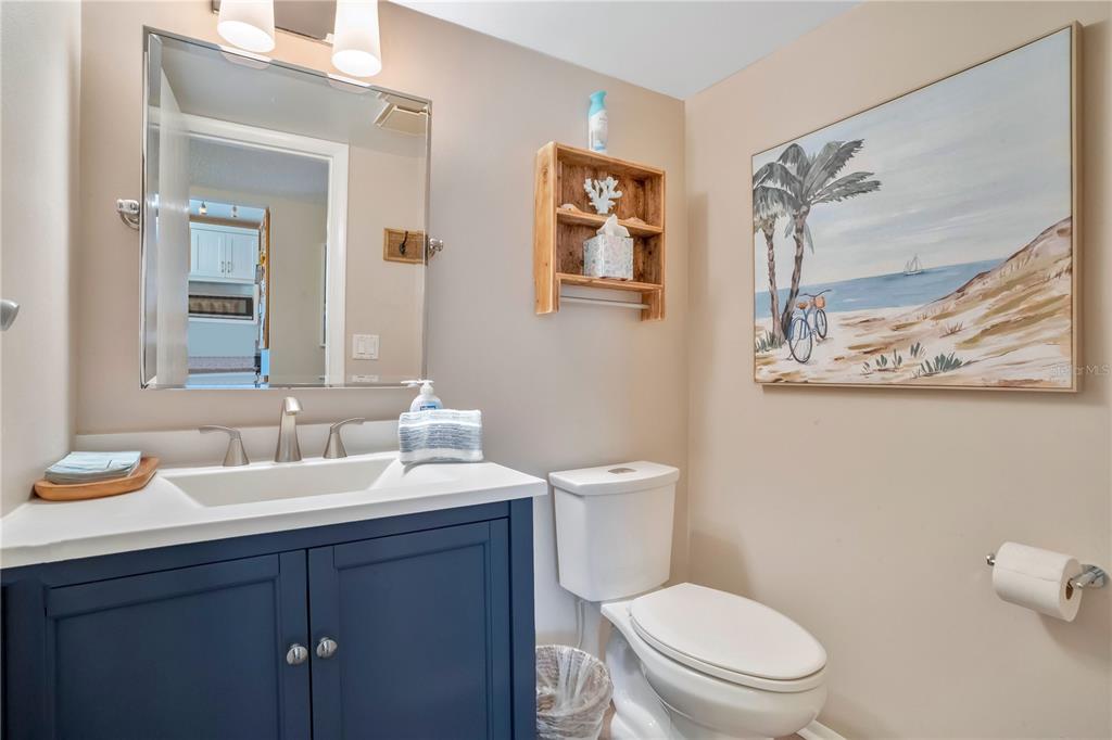 1646 Stickney Point Road, Unit 1646101 Sarasota, FL 34231 - Photo 25 of 67 a bathroom with a toilet a sink and mirror