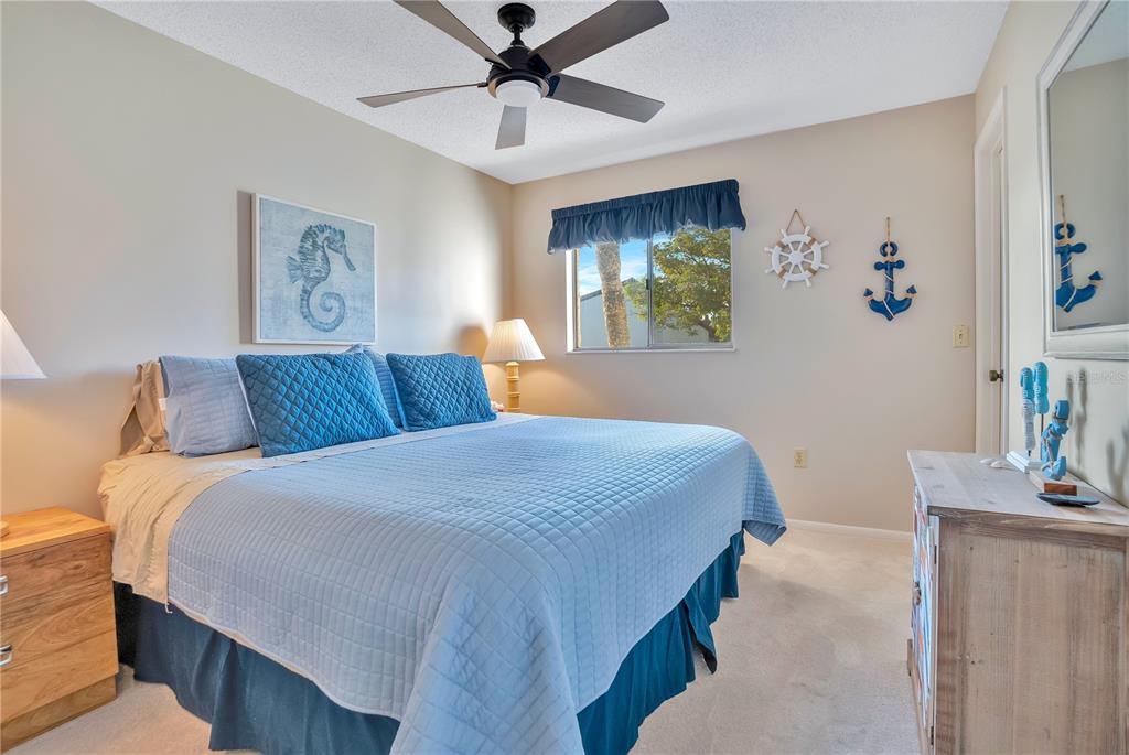 1646 Stickney Point Road, Unit 1646101 Sarasota, FL 34231 - Photo 26 of 67 a bedroom with a bed and a table